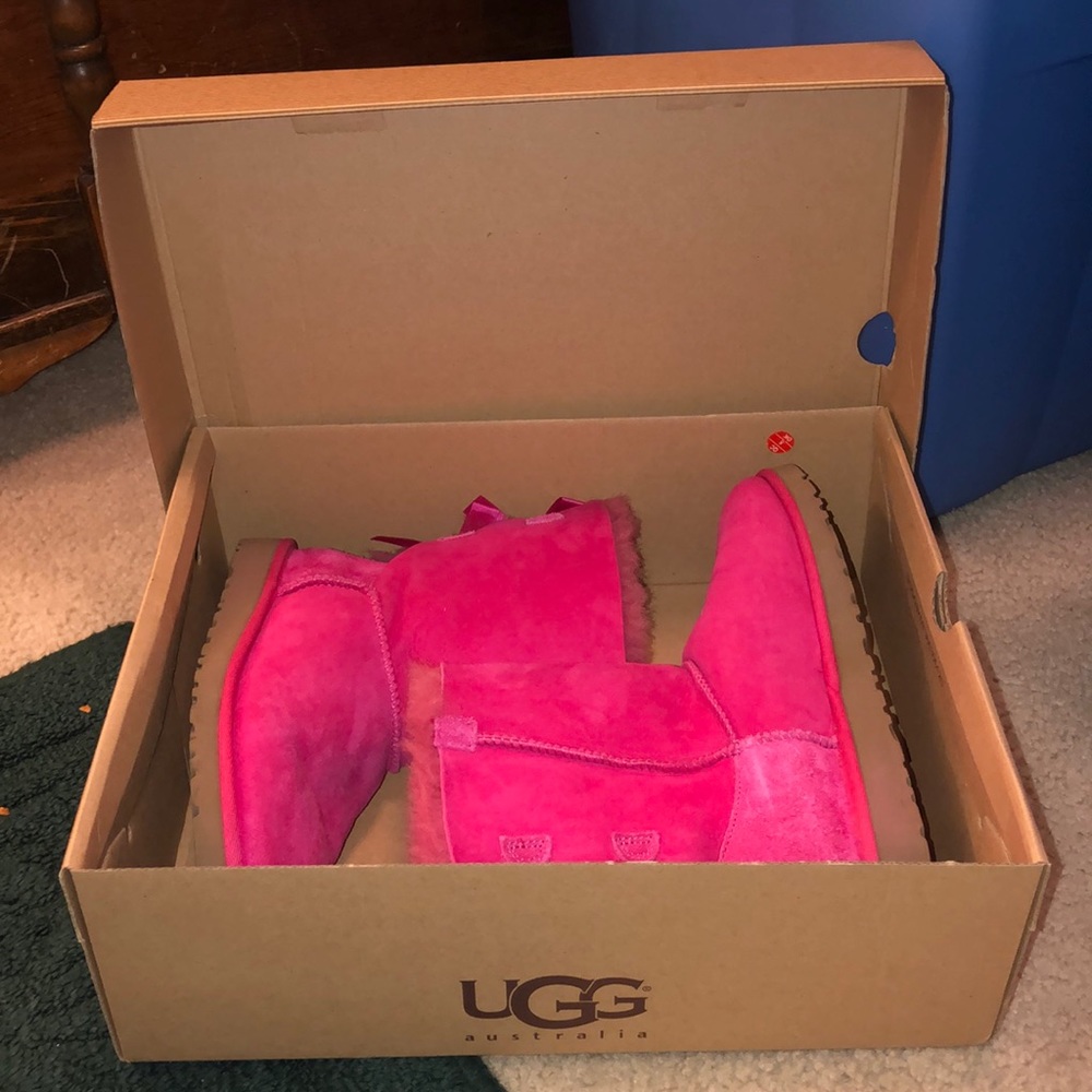 hot pink UGG boots with 2 ribbons
